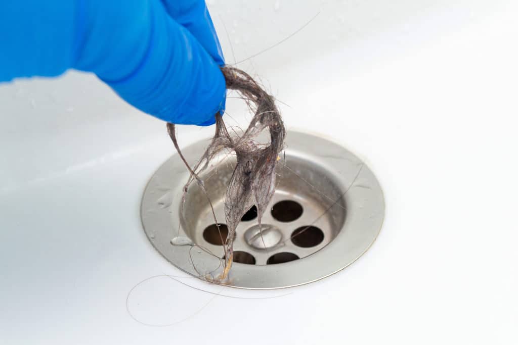 How To Remove Hair From The Drain With A Hanger 